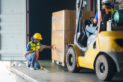 forklift loading freight onto truck, using OTR coverage