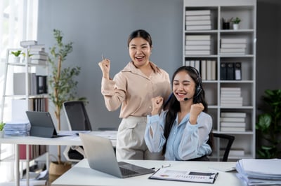 warehouse workers smilling with the right logistics data