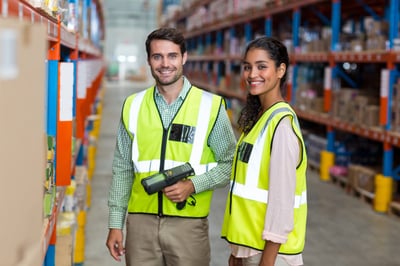 warehouse workers using API tech in logistics