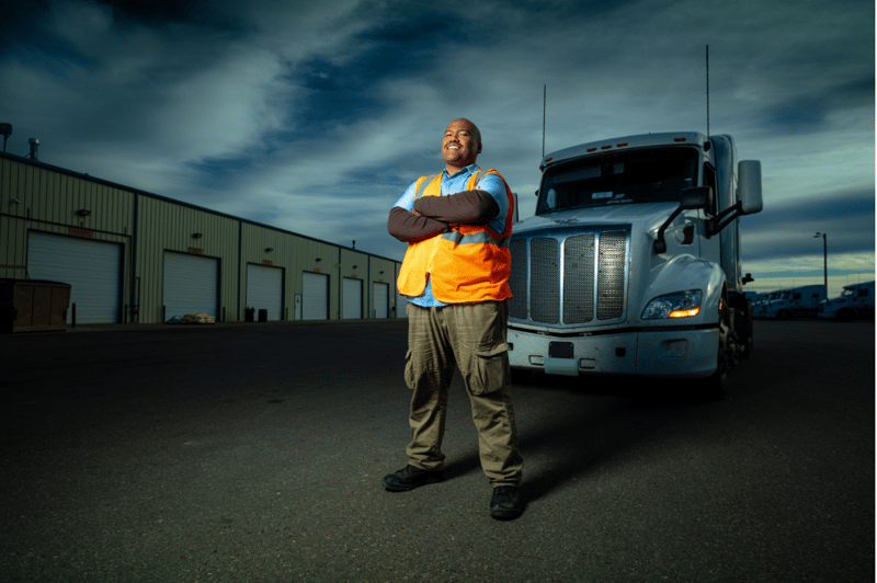 Truck driver with truck and loading bays