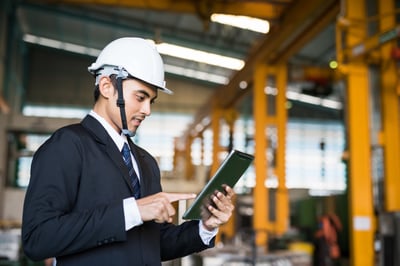 man looking at tablet discussing nearshoring