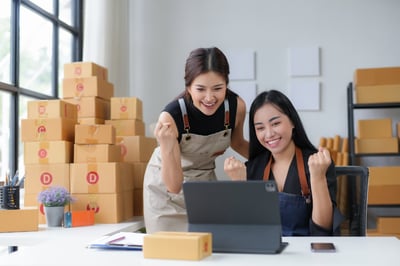 two women reducing their freight audit costs